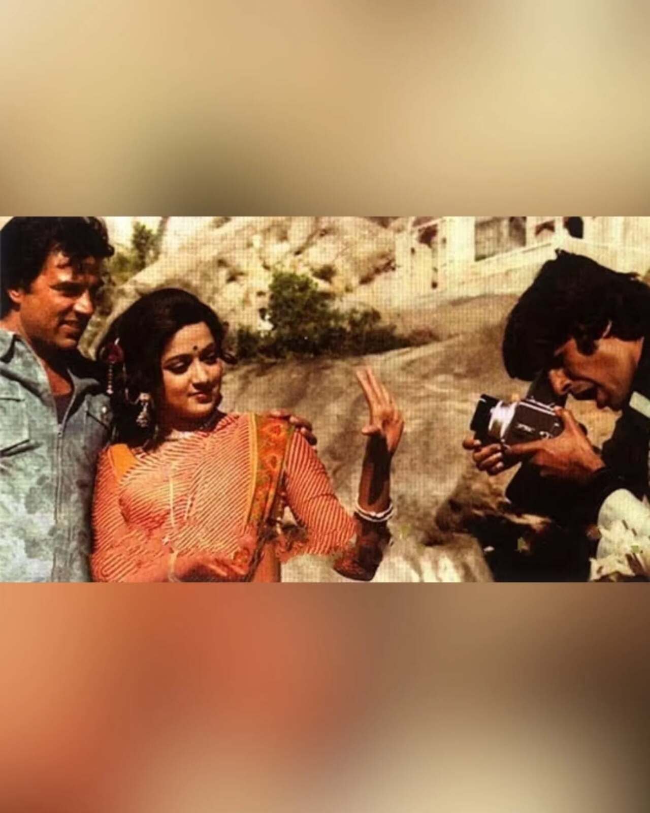 This film changed the lives of actor's in many ways. One of the highlight was Hema Malini and Dharmendra's romance. This joyous pic captures Amitabh Bachchan clicking an adorable picture while the lovebirds pose. 